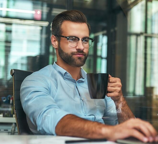 Morning Coffee. Portrait Of Young And Successful Bearded Man In